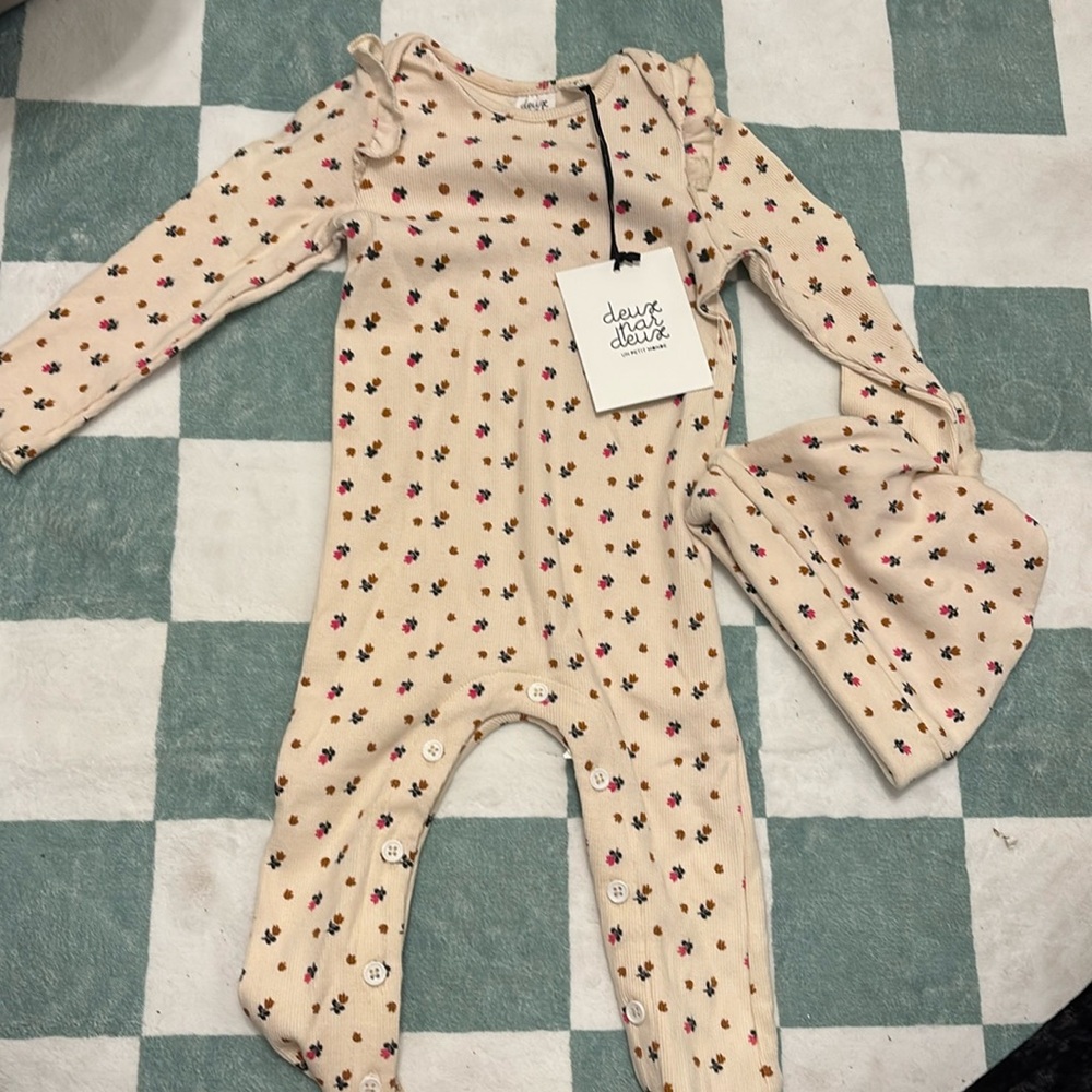 A girly warm one piece. Whip cream, and flowers perfect for this winter.
